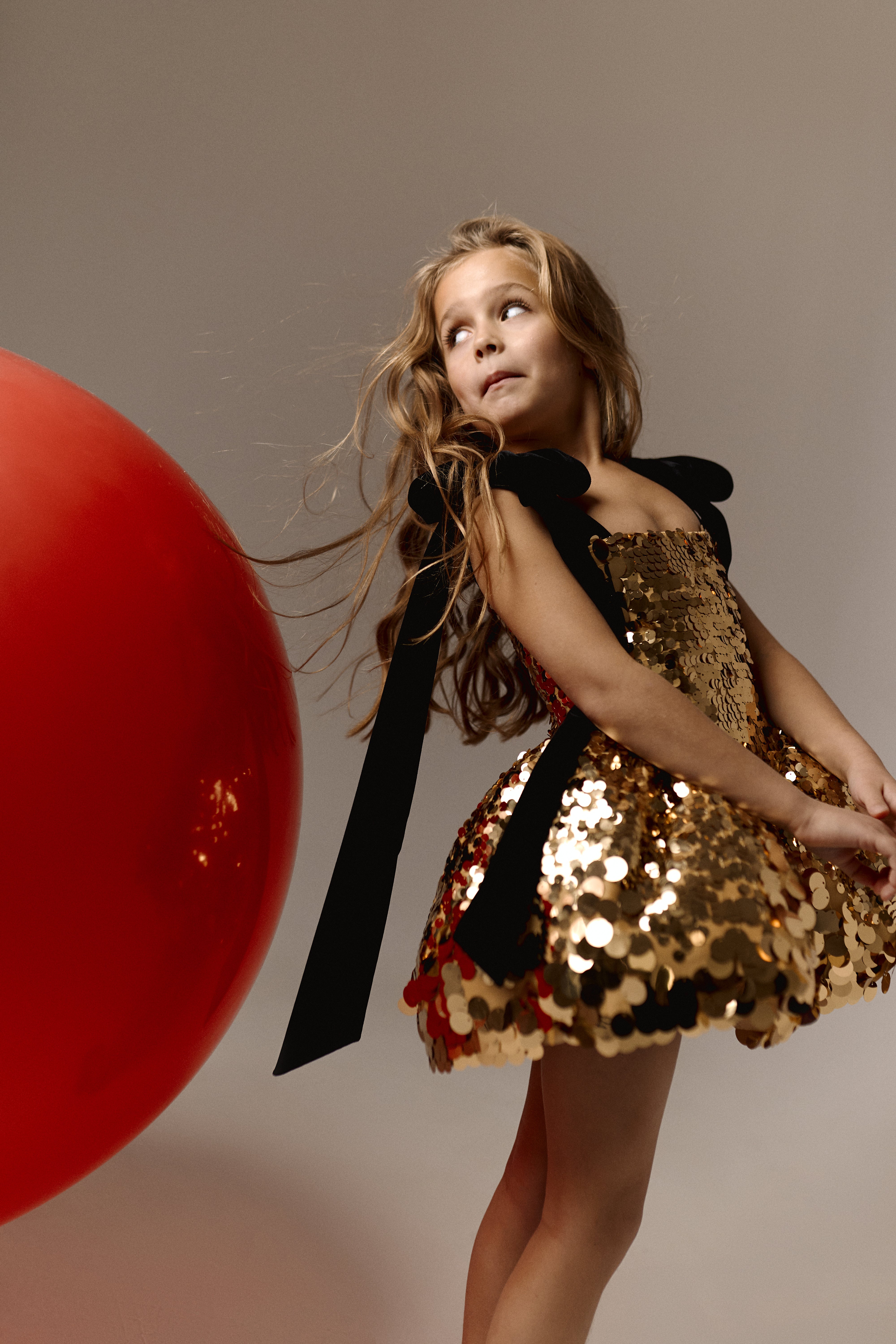 gold sequin dress with black bow Elinda